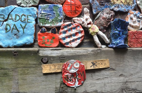 A coke can junky on an exterior wood beam in Drewery Lane, Melbourne, along with some small clay pieces