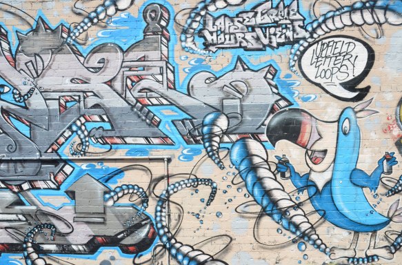 mural in turquoise and grey featuring a toucan