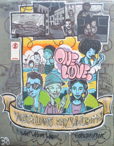 mural on a wall in Footscray Melbourne by Tim Rollin with the theme of One Love, Australians say welcome, featuring pictures of various kinds of people