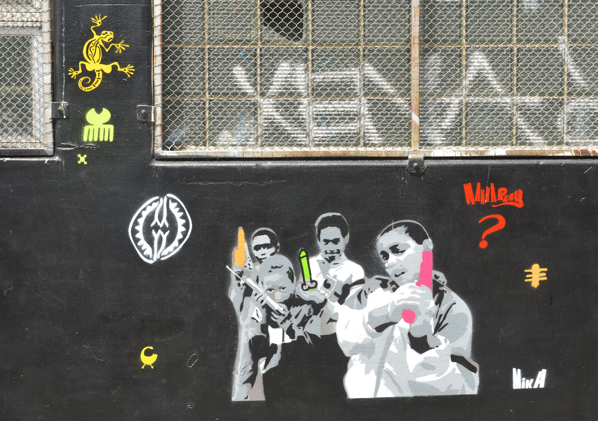 stencils on a black wall 