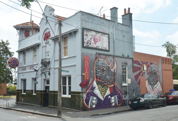 Napier Hotel, with a mural on the side, two animal like creatures, one (on the left) is a rhino