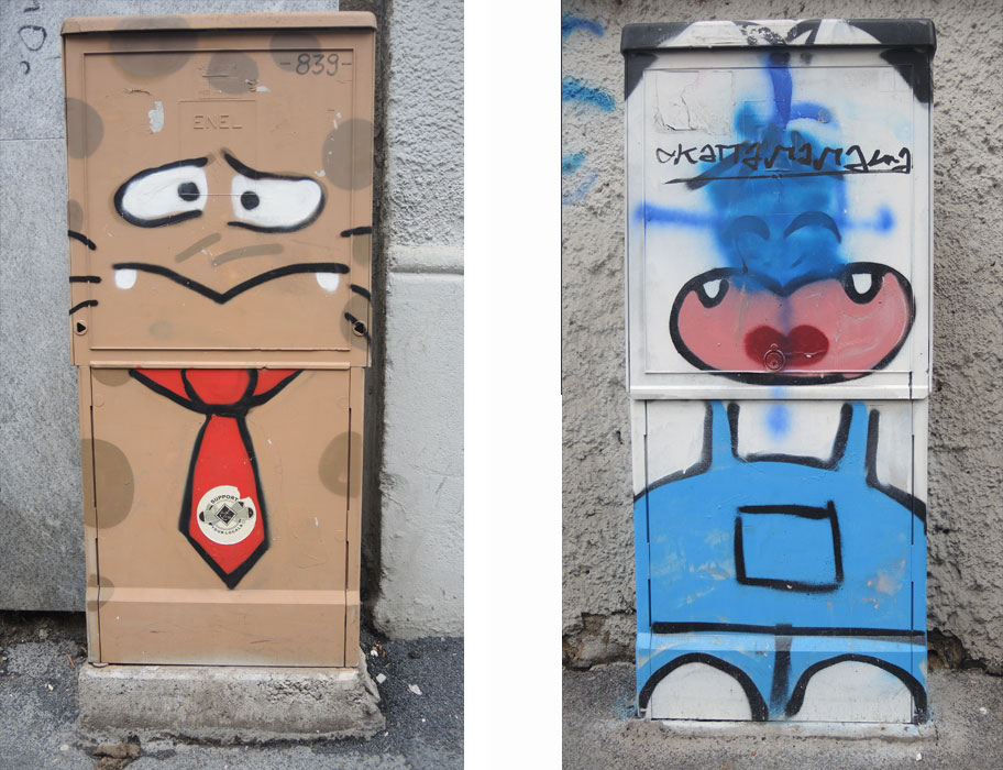 2 metal boxes on the sidewalks in Milan, both with street art. One is brown, a man's face with a scared look and he's wearing a red tie. The other is a stylized woman in blue overalls 
