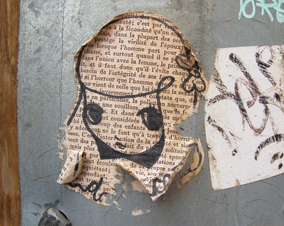 Starchild Stela character, a girl with shoulder length and slightly curly hair, drawn on a page of an old book whose words are in french.