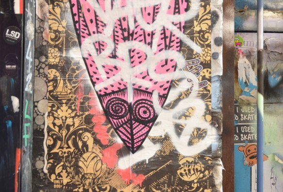paste up of a large pink mask