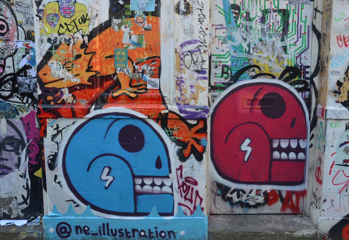 two large heads by ne illustrations, a blue head and a red head. 