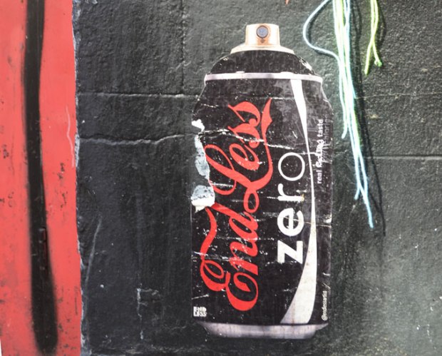 A coke zero black can is turned into a can of spray paint in this street art paste up. Instead of coca cola it says end less 