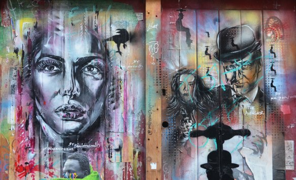 two street art portraits, on the right is character from the TV shaw the Avengers 