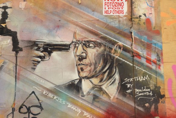 street art portrait of a man with a gun to his head, Statham, 