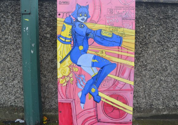 on a metal box beside the road, a blue kat superhero woman with an rocket tank on her back, brih=ght pink background, by Amanda Deer 