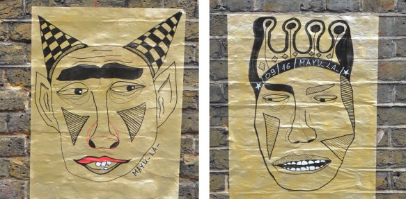 two street art paste up posters on gold paper, both drawings of male figures, one with black and white checkerd horns, the other with a crown. 