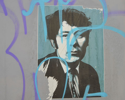 poster of a portrait of a man with ripped corners