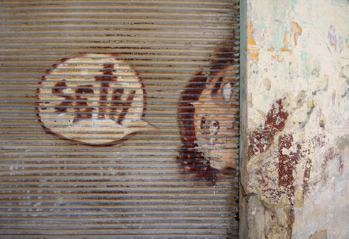 the word Seth in a word bubble, with the top part of a man's head as he pokes his head around a wall. 