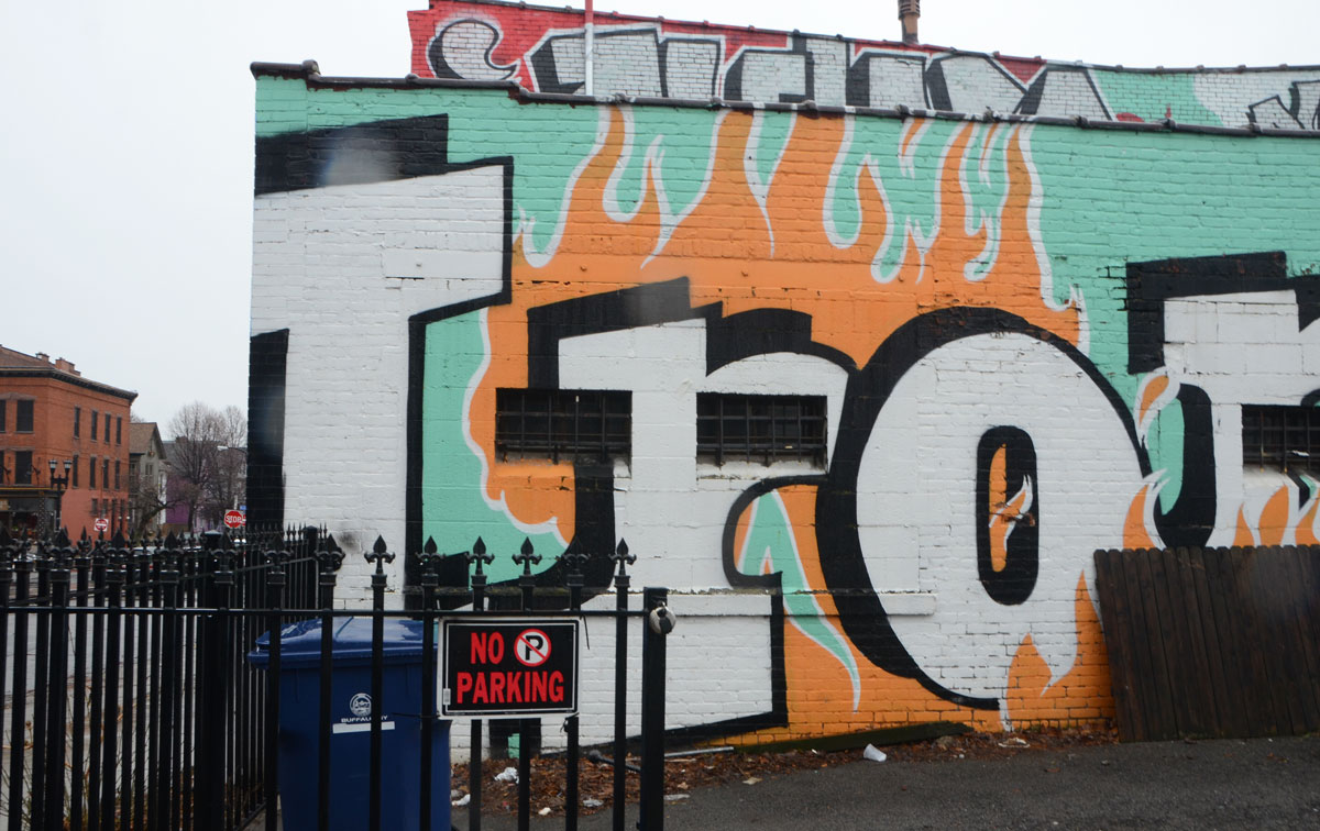 word Iron written in large letters, part of a mural 