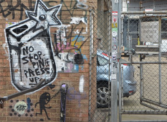 graffiti on a brick wall including a little stick figure man with a large head by n'ice pops, and the words no stopping 