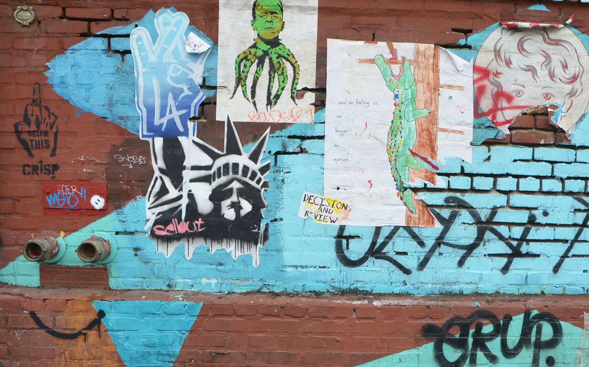 paste up graffiti on the wall of the Angel City Brewery