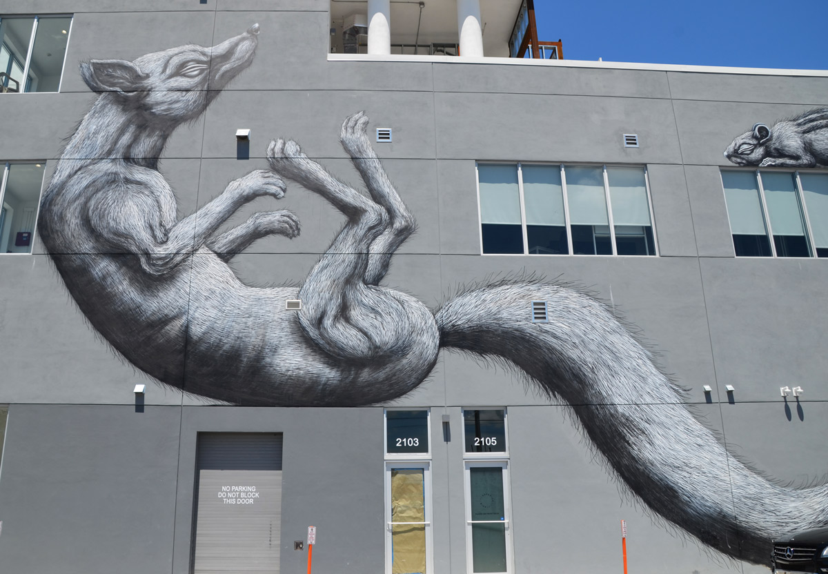 father adult rodent in mural by roa