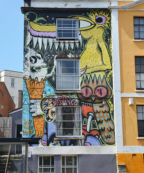 a yellw bird creatre with a long beak, an owl and an ice cream cone 