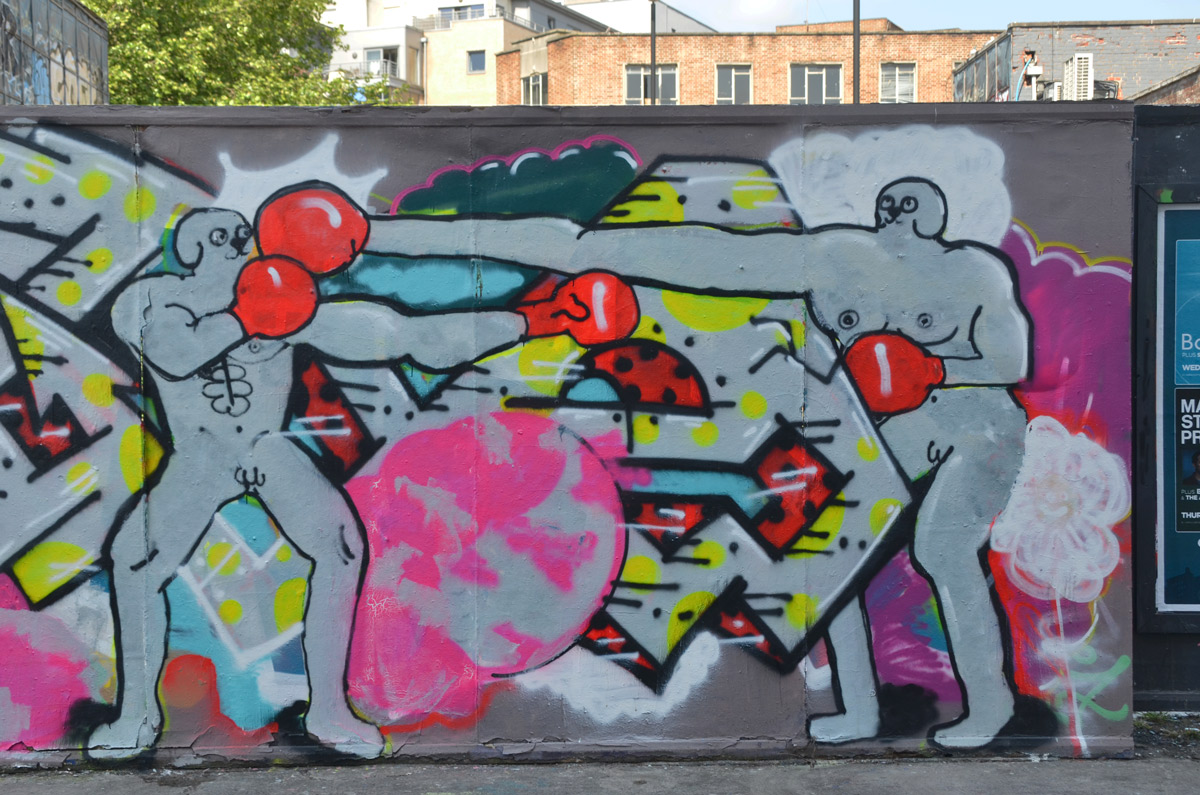 mural of naked men with red boxing gloves