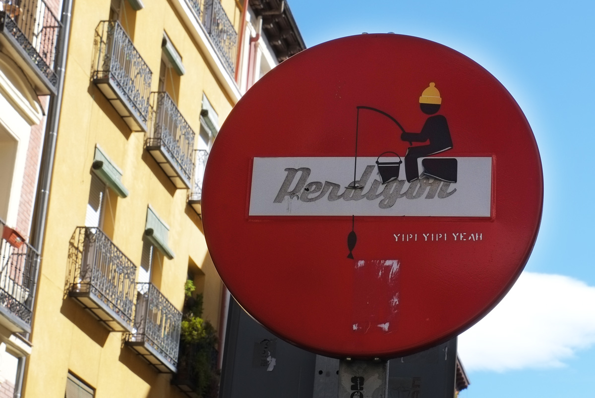 man fishing in the white bar of a do not enter sign