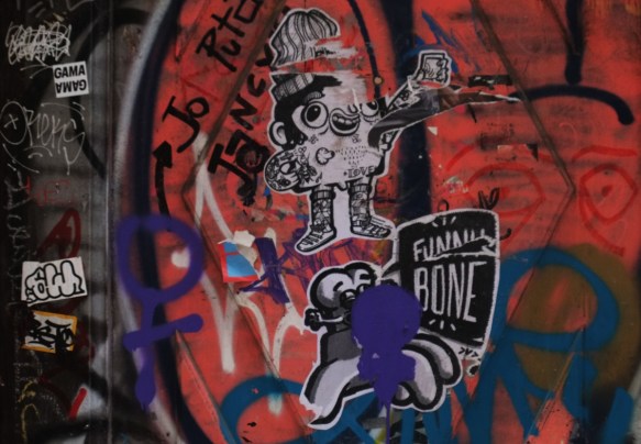 stickers on a door that has a red tag on it. 