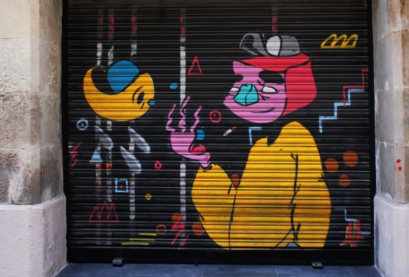 cartoon like painting on a door, pink faced person with bright yellow sweater, a yellow fish 