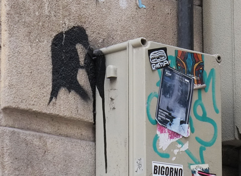 stencil, black bird eating something 