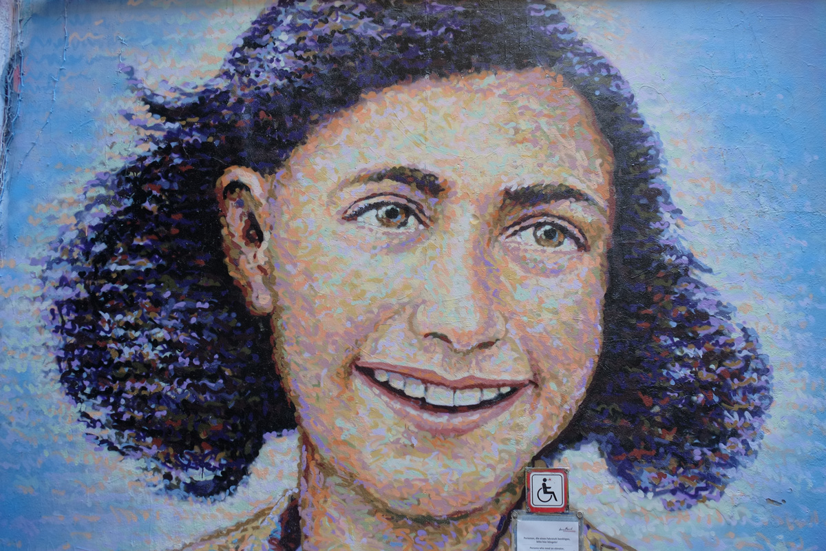 large mural of ann frank, head