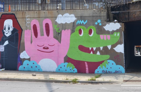 party animals mural by Blake Jones of a large pink rabbit and a green crocodile