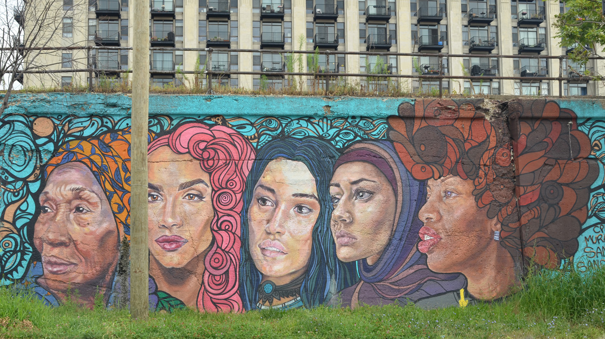 part of a mural by Sam Kirk and Sandra Antongiorgi of five large women's heads