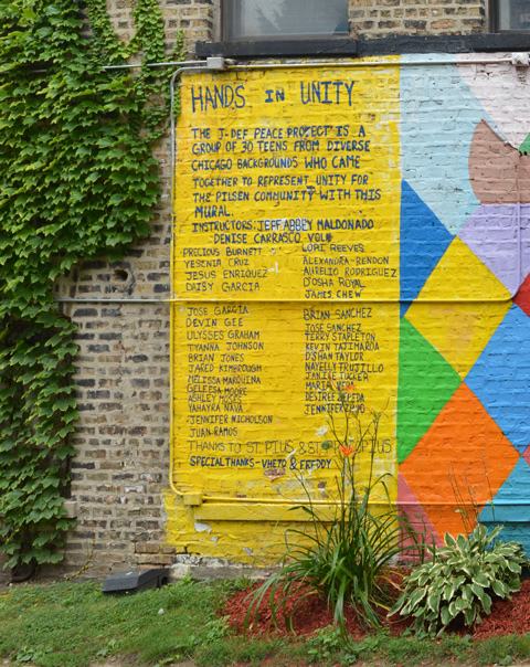 on a yellow background, a list of 30 names of the young people who helped to create a mural on a brick wall on the exterior of St. Pius church