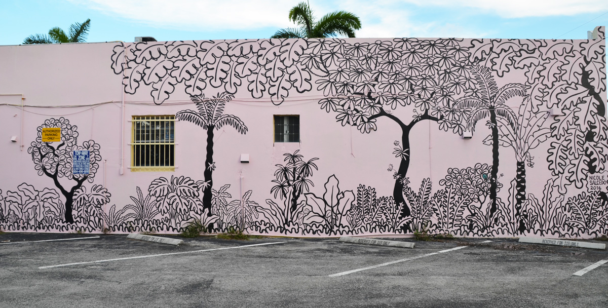 mural by Nicole Salcedo, a pale pink wall with black outline drawing of trees and plants 