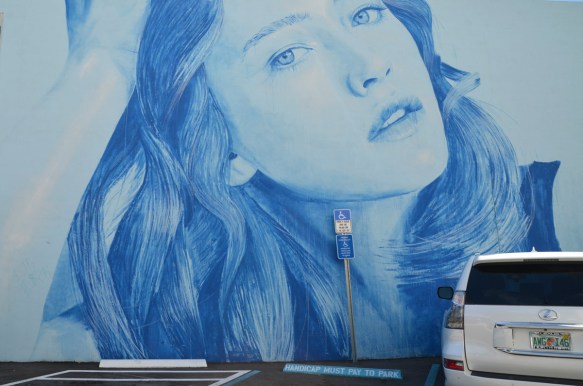 rone mural of a woman's head in blue tones