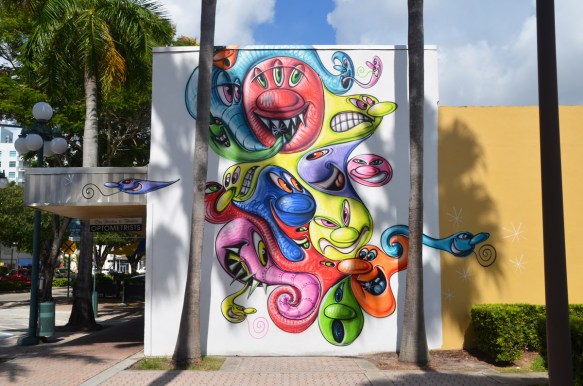 abstract cartoon like characters in a mural, palm trees 