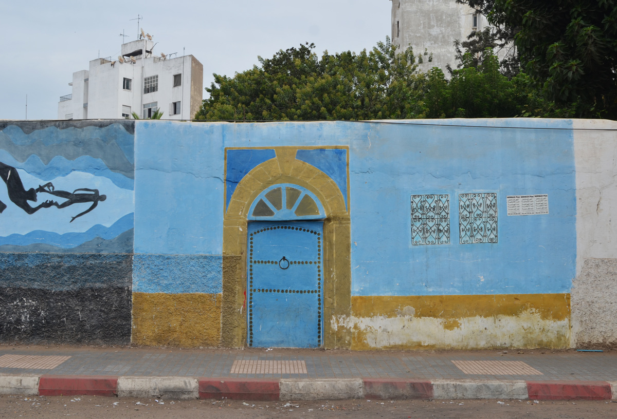 part of a series of murals on a Casablanca walla blue door with gold trim