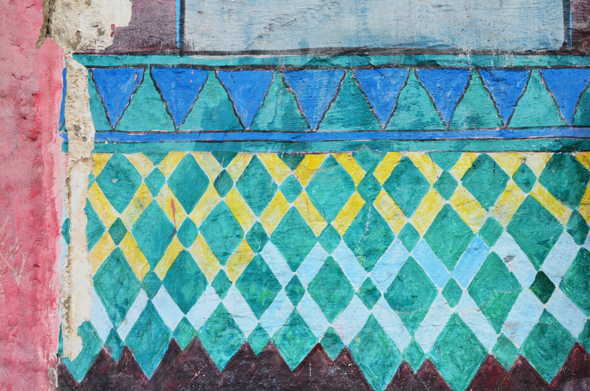 part of a series of murals on a Casablanca wall, tile patterns, triangles and diamond shapes in yellow, green, and blue