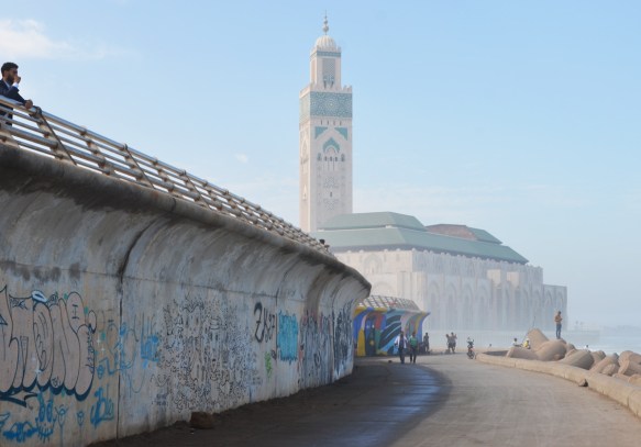 sea wall, with path below, beside the Atlantic Ocean in Casablanca, with Hassan 2 mosque in the background