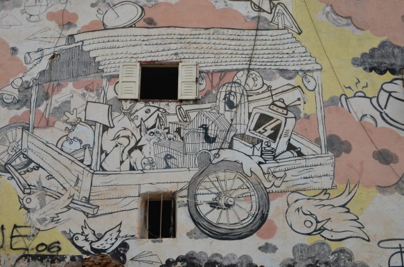 detailed painting of a wagon full of stuff, mural on a casablanca wall