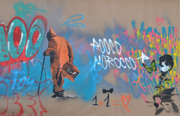 in a mural, an old man with a can and long orange coat with hood walks away, 1 plus one equals a heart 