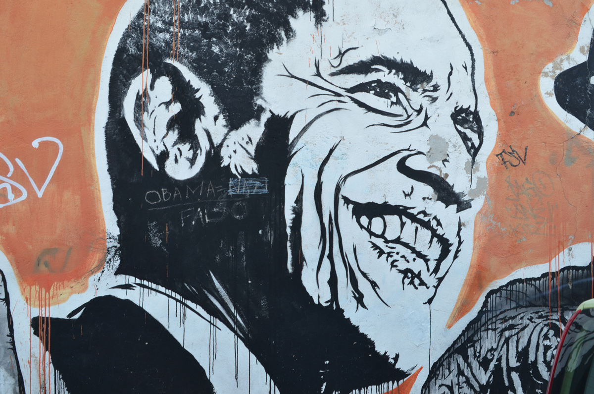 Barak Obama, large portraits by sten and lex, Italian street arts, in a mural on two sides of the street, of famous people and common people, 