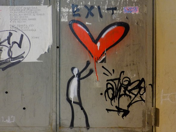 simple graffiti of a black stick figure with white filled in, reaching up to a red heart, with the word exit written above it 