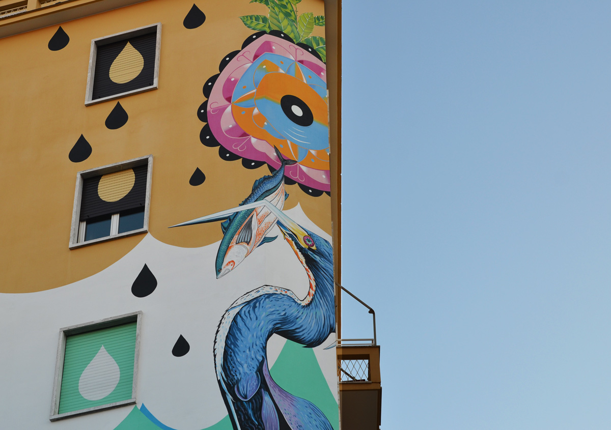 Upper part of a large mural called Hunting Pollution by Federico Massa also known as Iena Cruz, of a heron with a fish in its beak