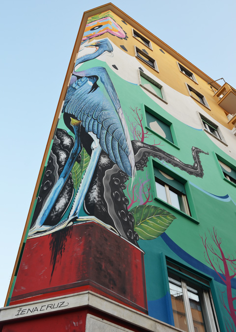 Lower part of a large mural called Hunting Pollution by Federico Massa also known as Iena Cruz, of a heron