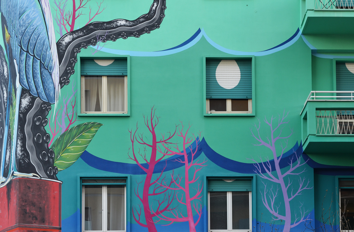 pink seaweed or trees in a mural with a heron