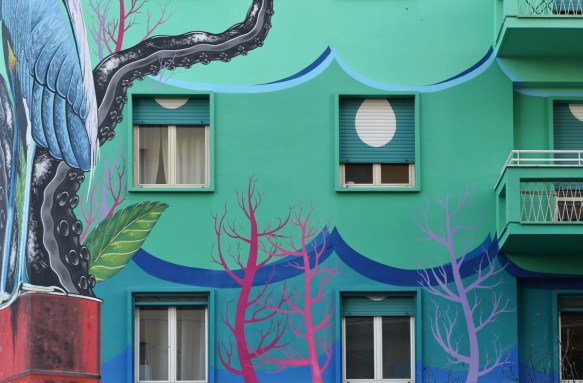 pink seaweed or trees in a mural with a heron