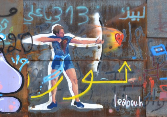 graffiti, an archer in blue top and shorts shoots a red heart from a bow 