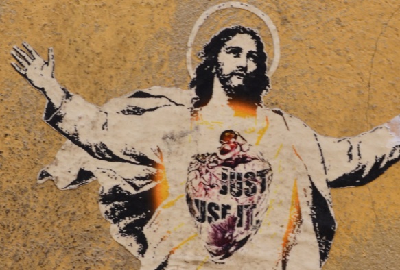 close up of Jesus's upper body and the picture and words on his chest