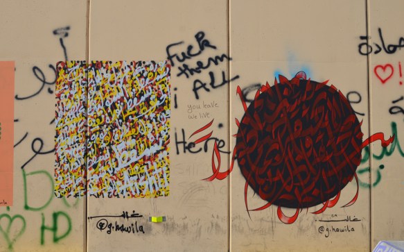two calligraphy graffiti pieces on a wall in Beirut
