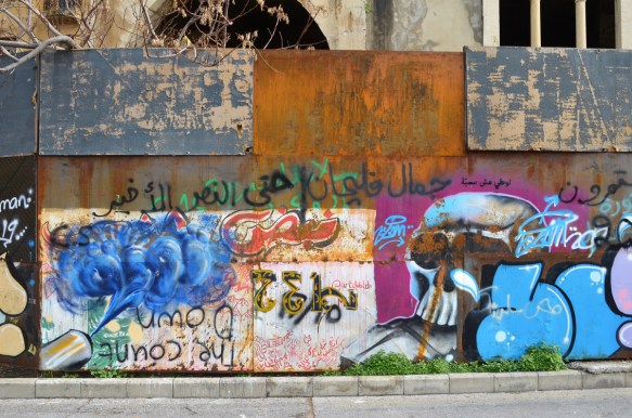 street art and protest graffiti on a wall, exterior 