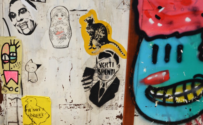 volti spenti graffiti as well as a babushka doll and a dinosaur