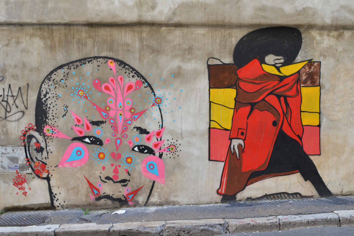 paper paste up, poster, ghosts, in black and white, on a concrete wall 